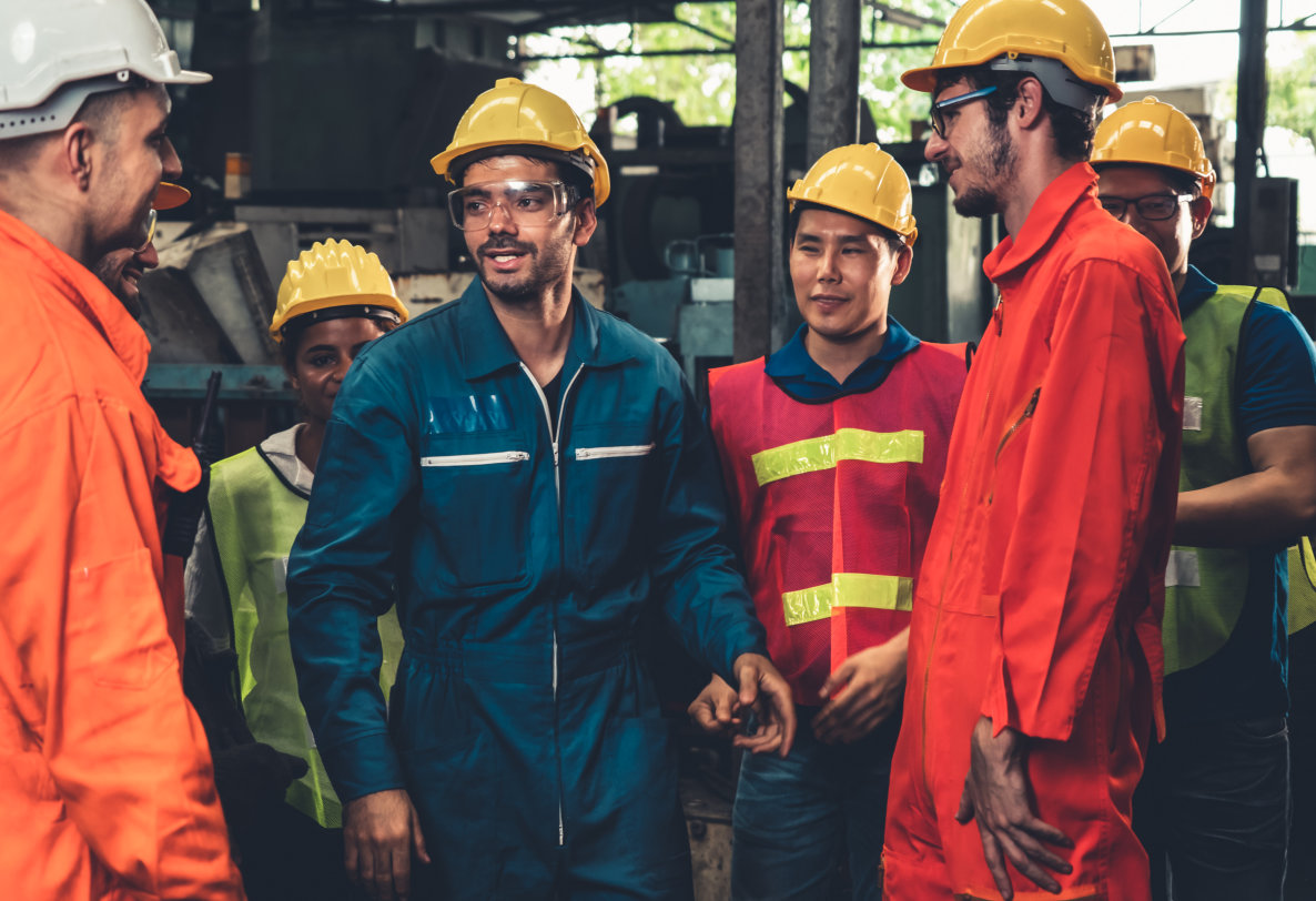 a group of workers in a factory or industrial setting