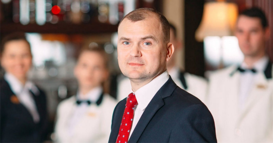 Hotel or restaurant manager and his staff in kitchen